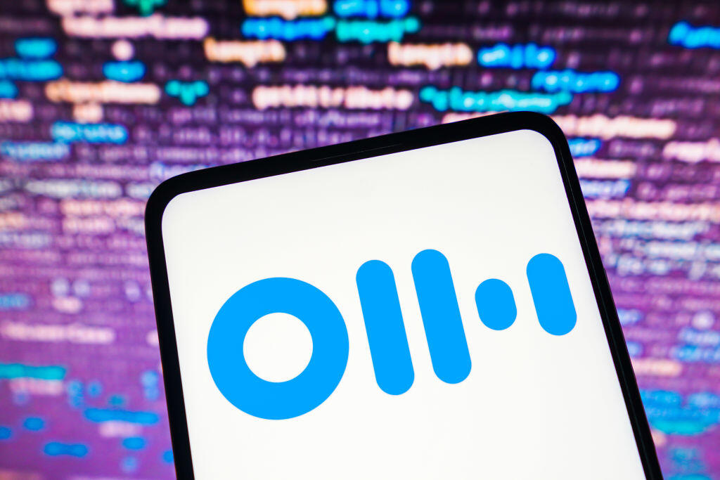 Otter AI logo on phone